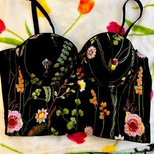 Black with flowers corset. Removal straps. Adjustable sizing. Never been worn.